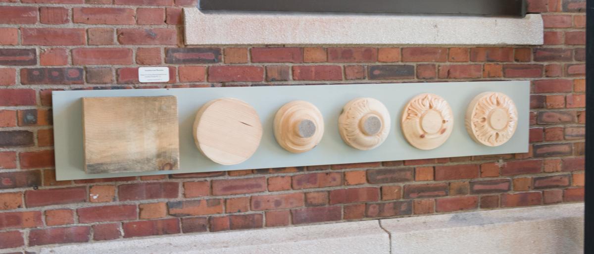 Stages in carving a rosette for building decoration