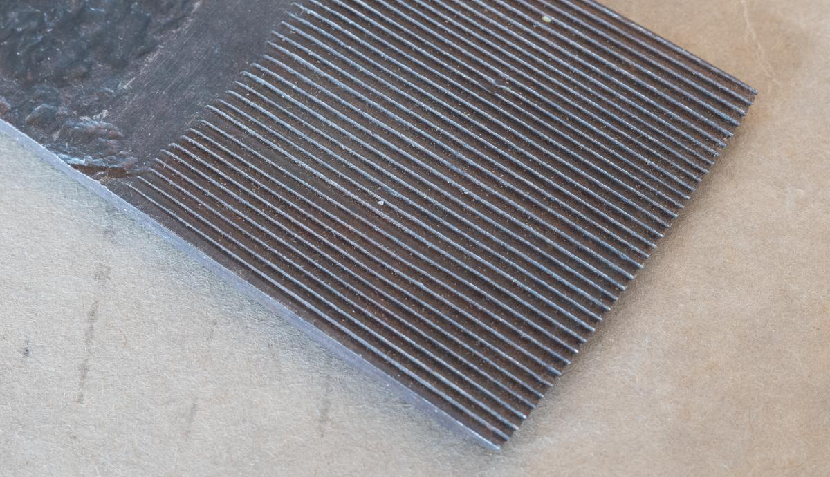 A close-up of a unused toothing iron by Two Cherries